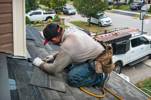 Professional Storm Damage Roof Repair technician working in Belleville, KS